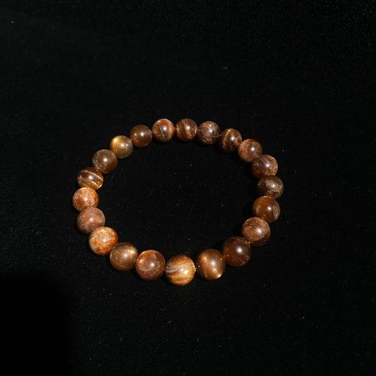 Blackcurrant Sunstone Meaning & Benefits: The Purple Sun for Wealth & Leadership